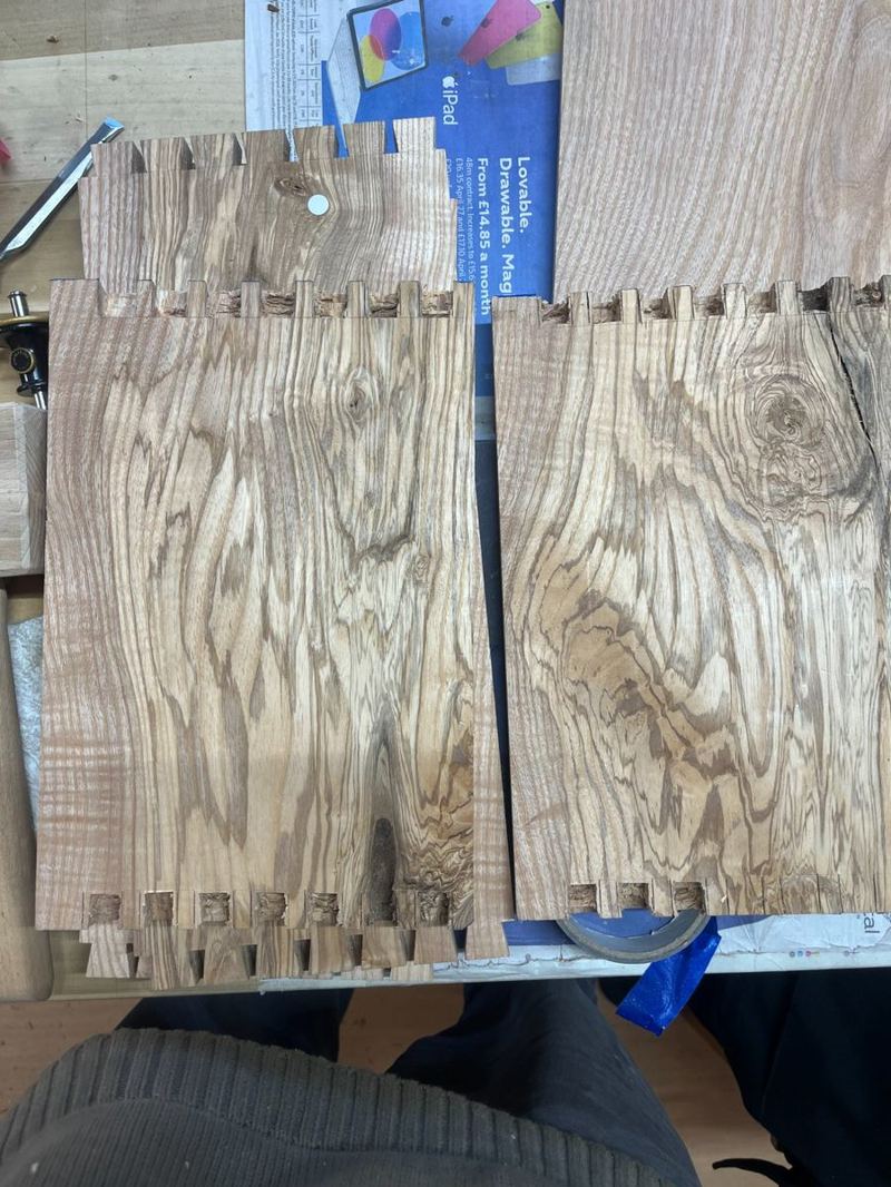 Figured ash sides — heavily figured grain selected for the carcass panels