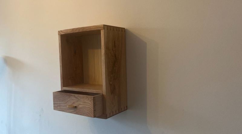 Left-angle, drawer open — piston-fit, closes on air resistance