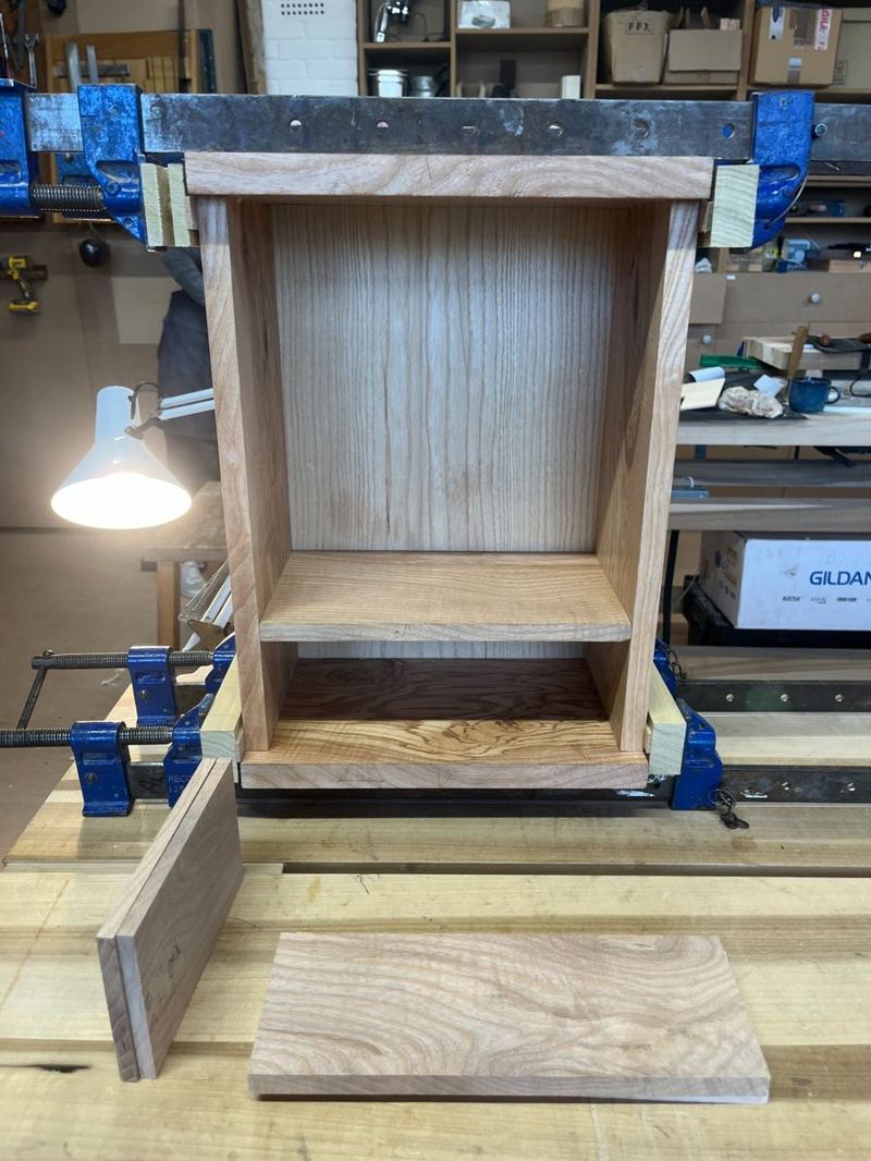 Carcass under clamps during glue-up — checked for square