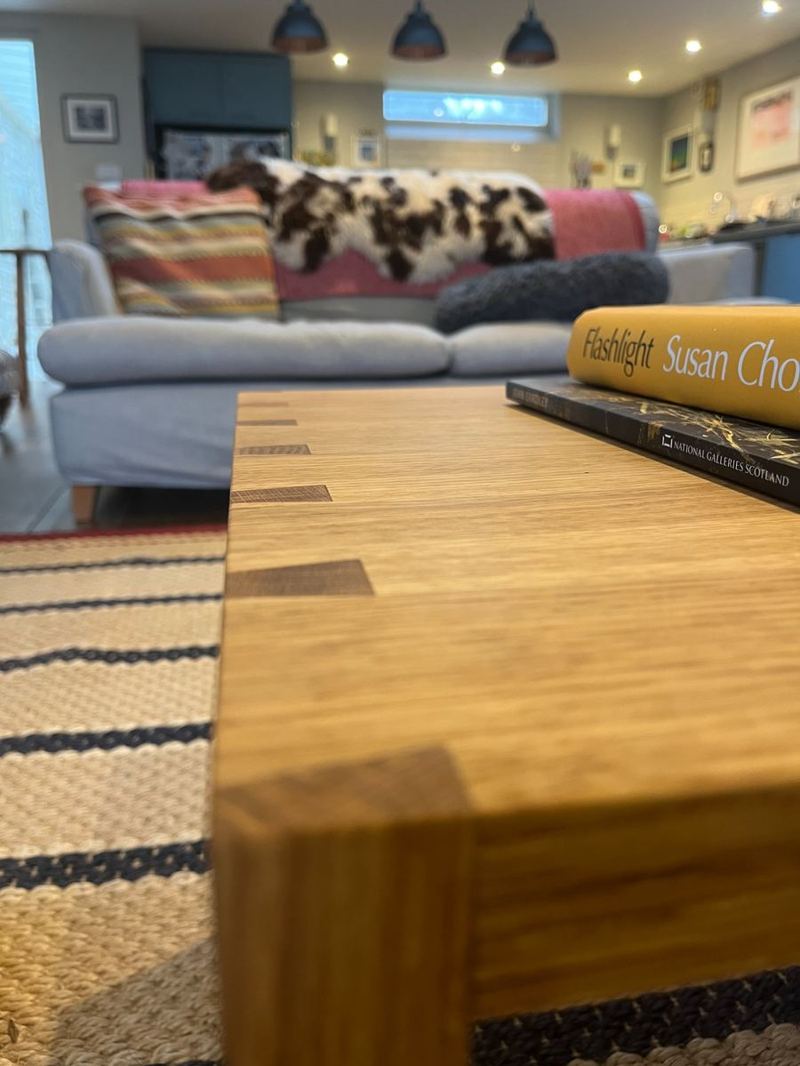 Corner joint — through-dovetail hand-planed flush and finished