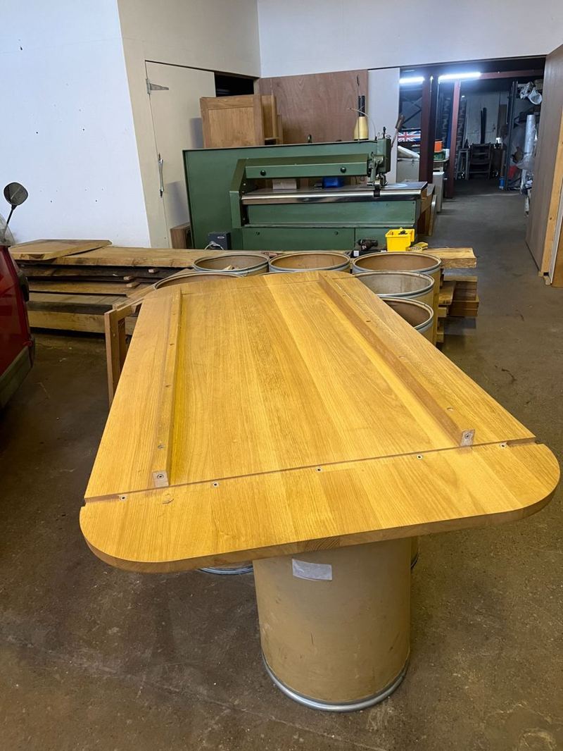 The recycled oak tabletop at Wardour Workshops — the raw material the piece was built from