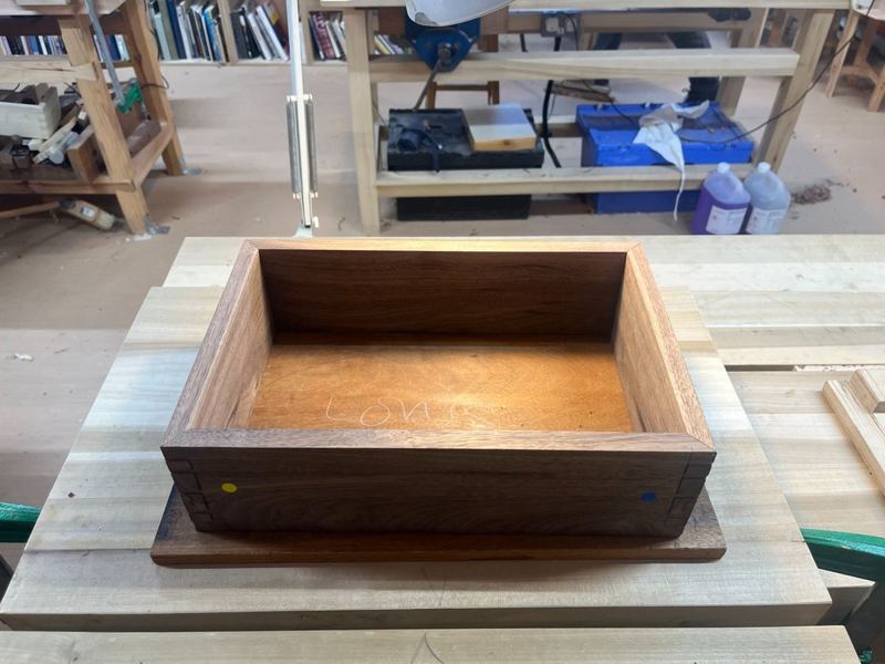 Interior — mahogany base hand-planed flush, grain matched against walnut sides
